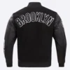 Brooklyn nets pro standard blended logo black varsity jacket 4