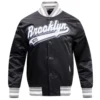 Brooklyn nets script tail full snap satin varsity jacket black 7
