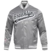Brooklyn nets script tail full snap satin varsity jacket gray 7
